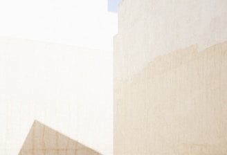 a man riding a skateboard down a street next to tall buildings