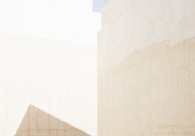 a man riding a skateboard down a street next to tall buildings